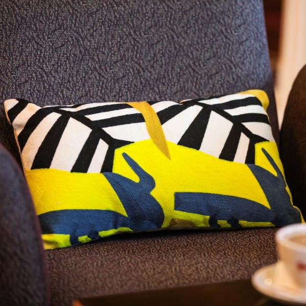 Yellow and black jungle print cushion - Woven Riches NI