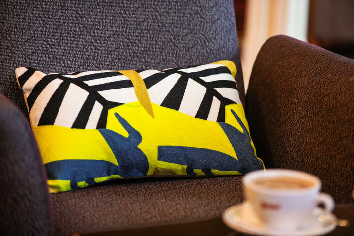 Yellow and black jungle print cushion - Woven Riches NI